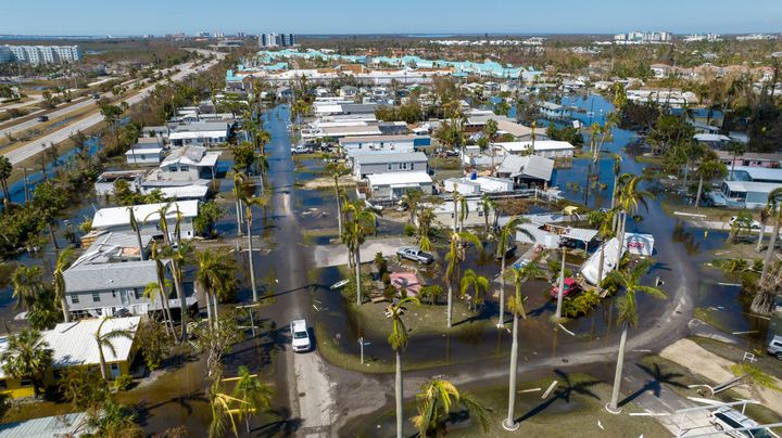 FILE - Water floods a damaged trailer park in Fort Myers, Florida on Oct. 1 after Hurricane Ian passed by the area.