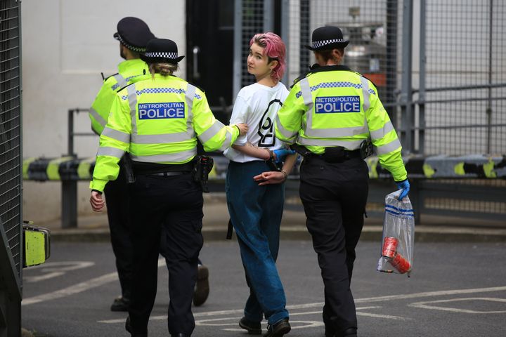 London’s Metropolitan Police said officers arrested two people on suspicion of criminal damage and aggravated trespass.