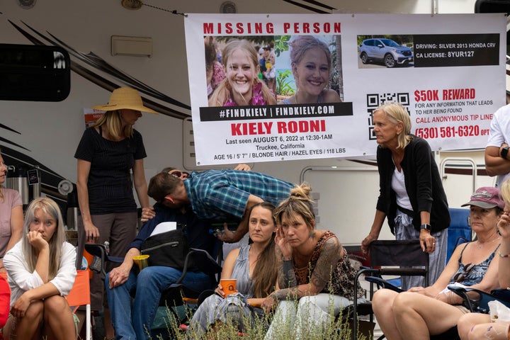 Lindsey Rodni-Nieman (Rodni's mother, center) listens to law enforcement during a news conference on Aug. 9 in Truckee.