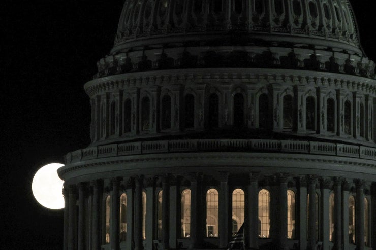 WASHINGTON, DC - OCTOBER 09: The Hunter’s Moon rises behind the dome of the U.S. Capitol on October 9, 2022 in Washington, DC. The Hunter’s Moon historically signaled the time for hunting with brighter moon light in preparation for the upcoming cold winter. (Photo by Alex Wong/Getty Images)