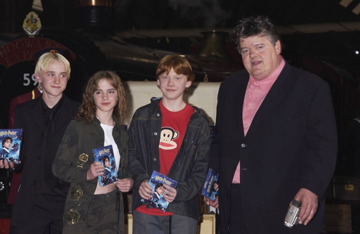 Robbie Coltrane with co-stars Tom Felton, Emma Watson and Rupert Grint in 2002