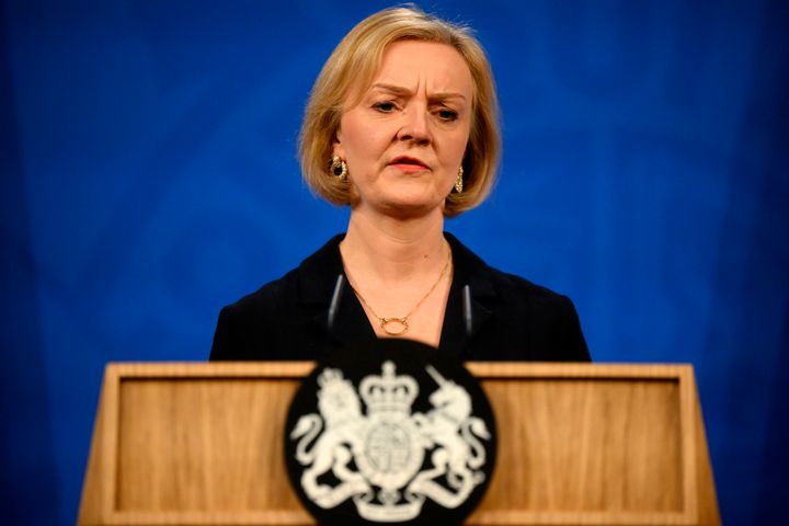 Britain's Prime Minister Liz Truss sacked her Treasury chief and reversed course on sweeping tax cuts Friday as she tried to hang on to her job after weeks of turmoil on financial markets.