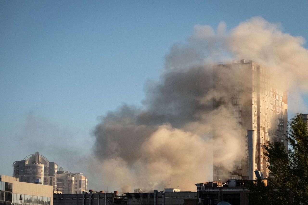 Smoke rises from a building after a drone attack in Kyiv on October 17, 2022, amid the Russian invasion of Ukraine. 