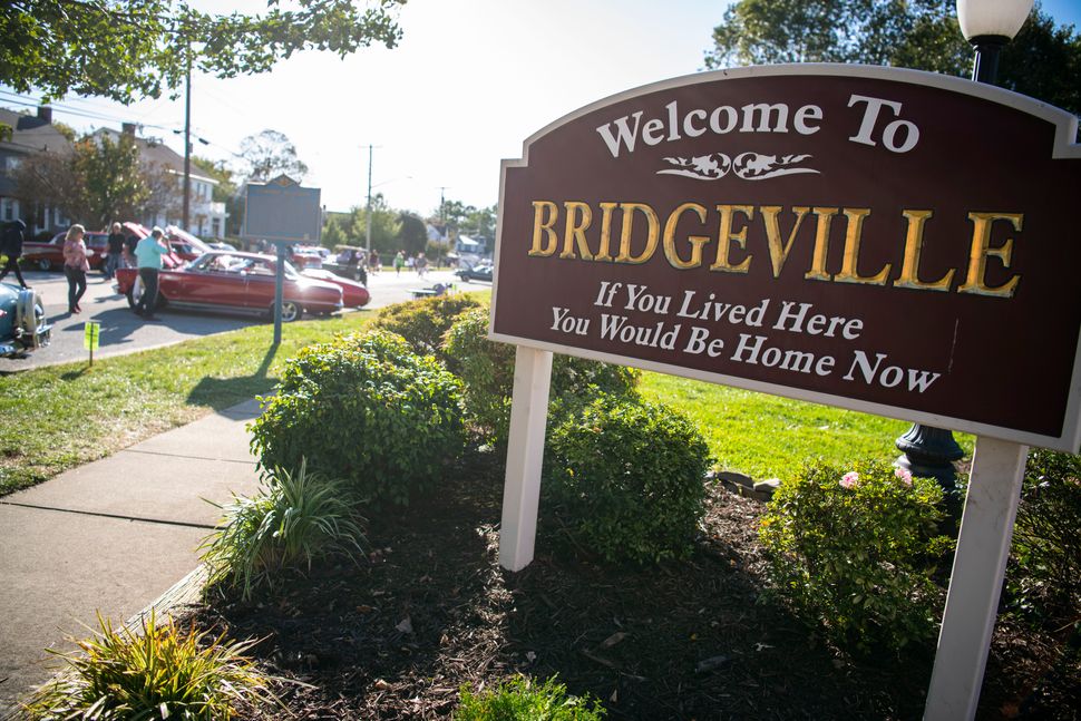 A "Welcome to Bridgeville" sign in the center of town.