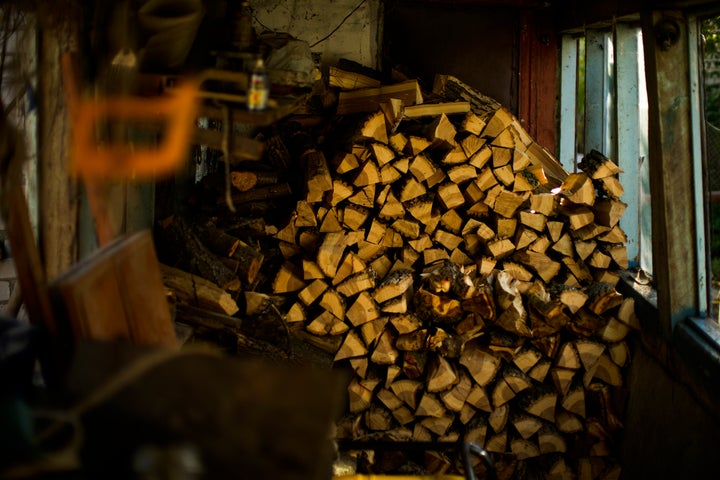 Pieces of firewood are piled in Viktor Palyanitsa's house in Kurylivka, Ukraine, on Oct. 16, 2022.