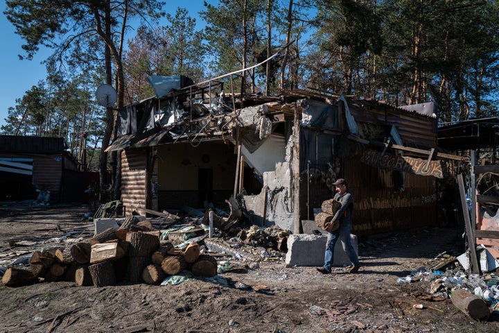 Civilians gather wood for heat and cooking in Donetsk.