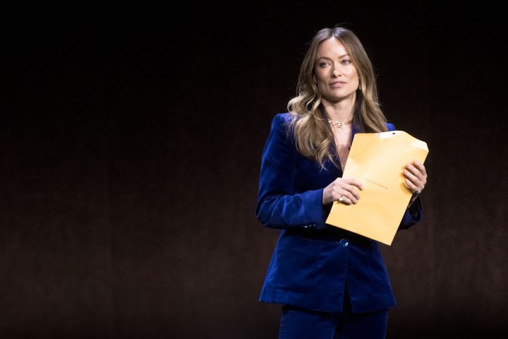 Olivia on stage at CinemaCon