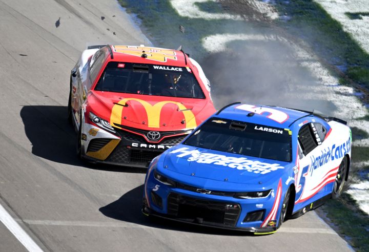 Bubba Wallace (in the red McDonald's car) and Kyle Larson collide in a NASCAR race in Las Vegas.
