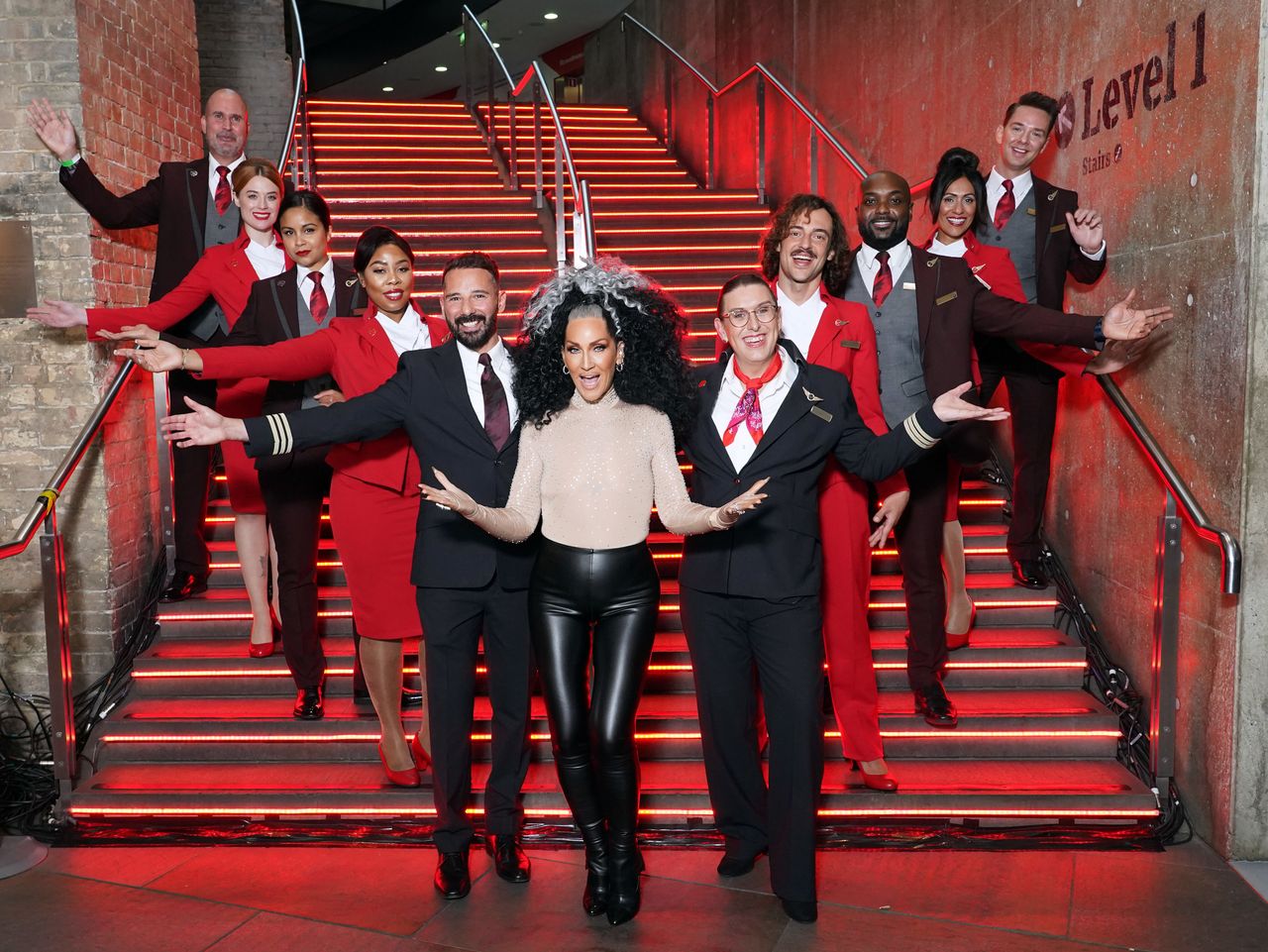 Michelle posing with Virgin Atlantic crew members at the Attitude Awards