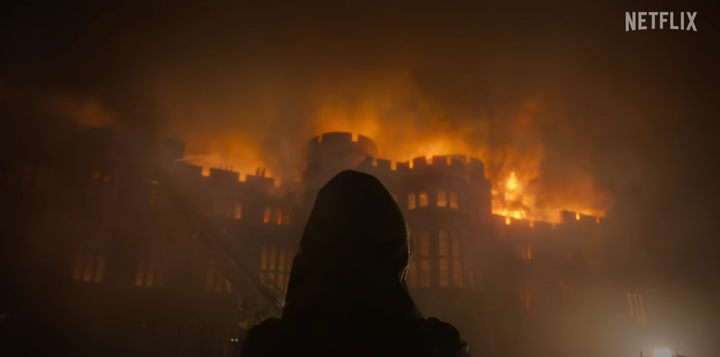 The new trailer opens with a shot of Windsor Castle ablaze