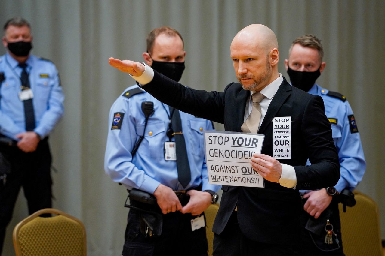 Anders Behring Breivik makes a Nazi salute as he arrives in court on Jan. 18, 2022, in Skien prison, Norway. The mass murderer, who said he was fighting a "Muslim invasion" in Europe, was sentenced in 2012 to at least 21 years in prison for terror attacks that killed 77 people. Under Norwegian law, Breivik was entitled to a review in court for possible release on parole after serving the initial 10 years of his sentence, but his parole was denied.