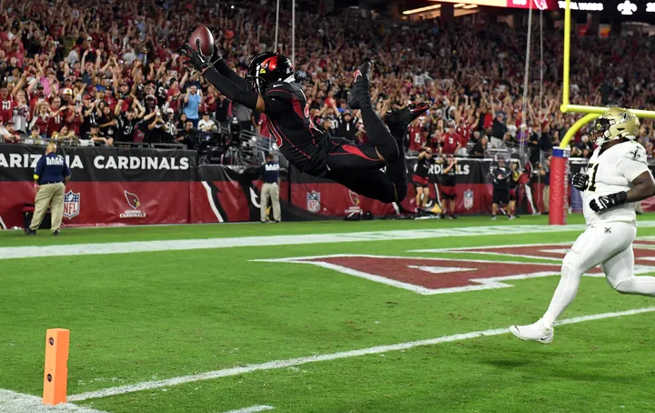 Cornerback (20) Marco Wilson of the Arizona Cardinals warms up before  playing against the Green Bay Packers in an NFL football game, Thursday,  Oct. 28, 2021, in Glendale, Ariz. (AP Photo/Jeff Lewis