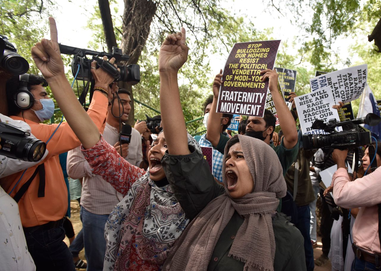 People protest against the demolition of the house of activist Afreen Fatima and her father, Javed Mohammad, on June 13, 2022, in New Delhi, India. 