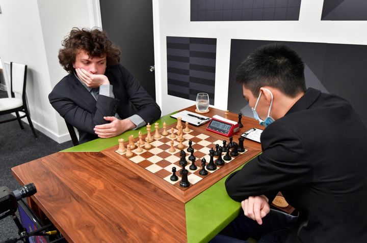 US international grandmaster Hans Niemann (L) plays a second-round chess game against Jeffery Xiong on the second day of the Saint Louis Chess Club Fall Chess Classic in St. Louis, Missouri, on October 6, 2022. - Niemann said on October 5 that he "won't back down," after the chess platform chess.com reported he has "probably cheated more than 100 times" in online games. (Photo by Tim Vizer / AFP) (Photo by TIM VIZER/AFP via Getty Images)