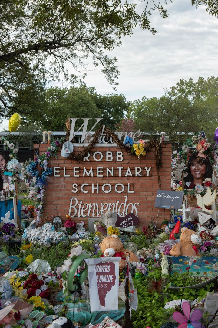 FILE - A memorial sits outside of Robb Elementary School for the 21 lives taken by a gunman in Uvalde, Texas.