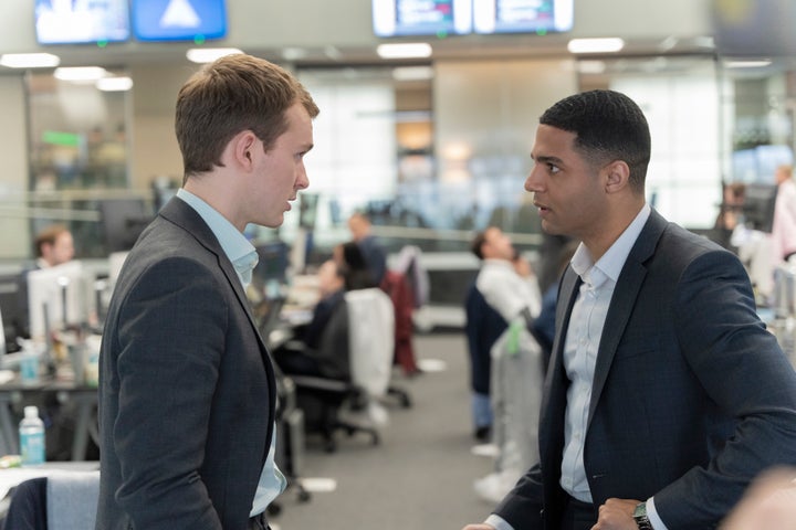 Seasoned trader Danny (Alex Alomar Akpobome, right) has a more pristine, polished sense of style than junior banker Robert Spearing (Harry Lawtey, left).