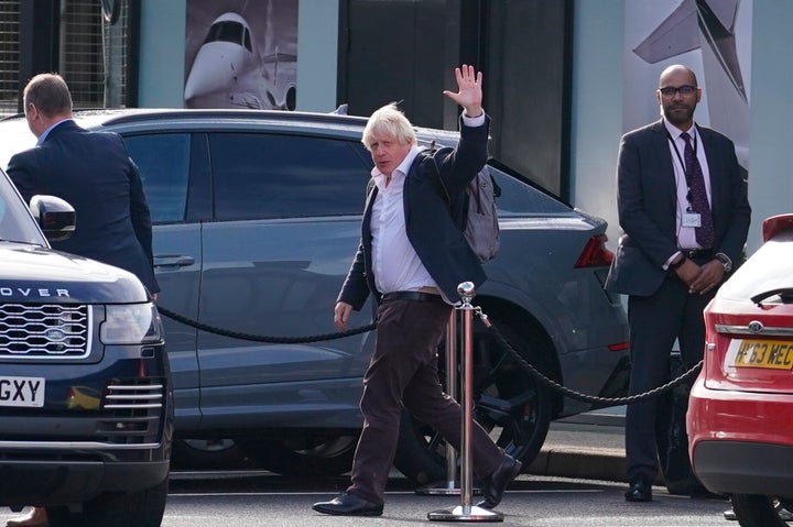 Former Prime Minister Boris Johnson arrives at Gatwick Airport in London, after travelling on a flight from the Caribbean, following the resignation of Liz Truss as Prime Minister, Saturday Oct. 22, 2022.