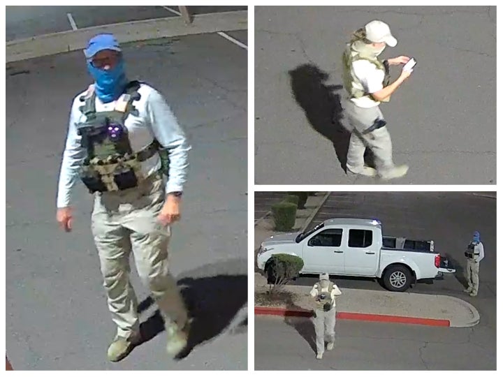 Two armed individuals dressed in tactical gear surveilled a ballot drop box in Mesa, Arizona, on Friday.