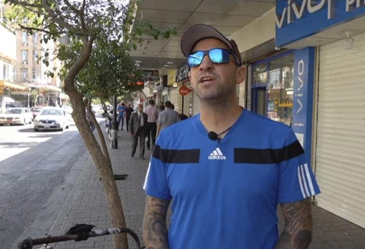 In this frame grab from video, 41-year-old Santiago Sánchez, a Spanish man who was documenting his travel by foot from Madrid to Doha for the 2022 FIFA World Cup, speaks to the Associated Press on a street, in Sulaymaniyah, Iraq, on Sept. 28.