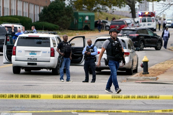 Law enforcement investigate the scene of a shooting at Central Visual and Performing Arts High School Monday, Oct. 24, 2022, in St. Louis. (AP Photo/Jeff Roberson)