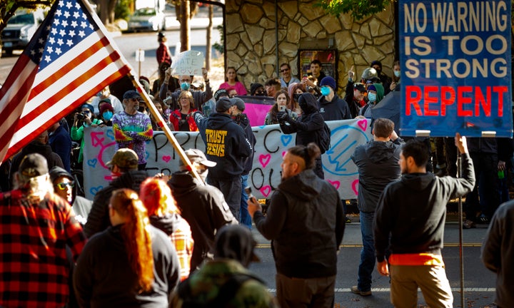 Protesters and supporters of a drag queen storytime event squared off in front of Old Nick's pub in Eugene, Oregon, on Sunday.