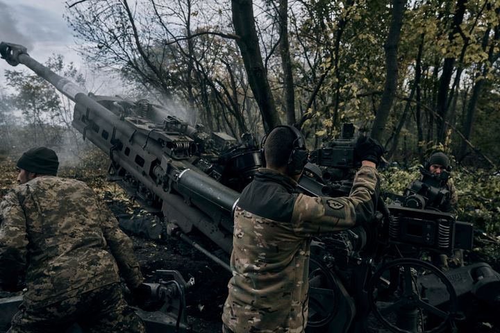 Ukrainian soldiers fire at Russian positions from a U.S.-supplied M777 howitzer in Ukraine's eastern Donetsk region on Oct. 23, 2022. 