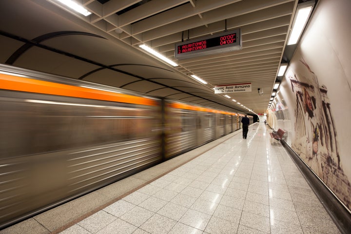 Athens, Greece - May 6, 2011: Man walking in the Acropolis subway station.