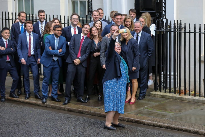 Coffey snaps a selfie with colleagues