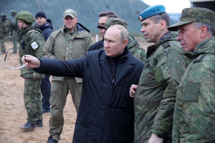 Russian president Vladimir Putin meets soldiers during a visit at a military training centre