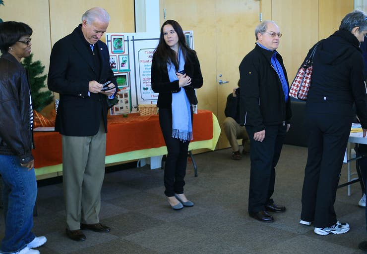 Then-Vice President Joe Biden stands in line to vote with his daughter Ashley Biden at a polling station on Nov. 2, 2010, in Wilmington, Delaware.