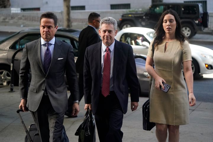 Attorneys Alan Jackson, left, Mark Werksman, center, and Jacqueline Sparagna, representing Harvey Weinstein, arrive at the Los Angeles County Superior Court on Monday. A jury of nine men and three women has been selected in the Los Angeles rape and sexual assault trial of Harvey Weinstein, and opening statements are set to start Monday.