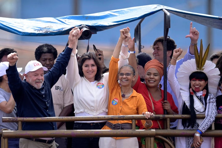 Da Silva has sought to build a "broad front" for democracy in the race against Bolsonaro, and has won the backing of key center-right politicians like Sen. Simone Tebet (center, in white), who has emerged as a powerful surrogate for the former president's campaign.