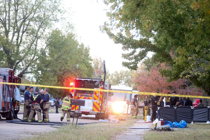 Broken Arrow, Oklahoma police and fire department investigate the scene of a fire with multiple fatalities.