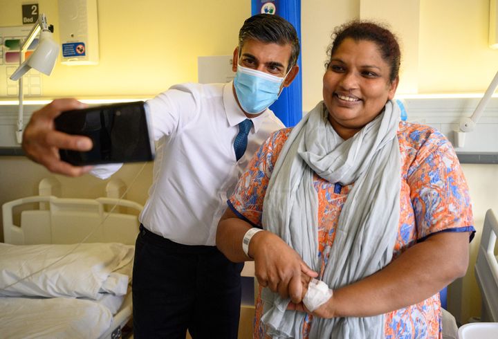 Sunak takes a selfie photograph with patient Sreeja Gopalan on the visit.