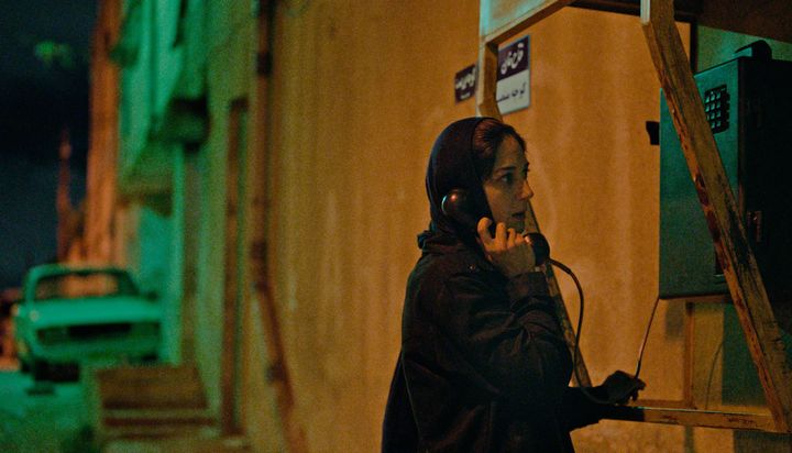 An Iranian female journalist (Zar Amir Ebrahimi) makes a desperate phone call in "Holy Spider."