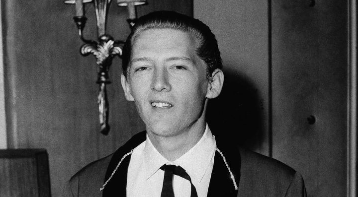 Singer Jerry Lee Lewis leaves the Westbury Hotel in London for rehearsals for his first appearance at the Regal, May 24, 1958. Spokesperson Zach Furman said Lewis died Friday morning, Oct. 28, 2022, at his home in Memphis, Tenn. He was 87.