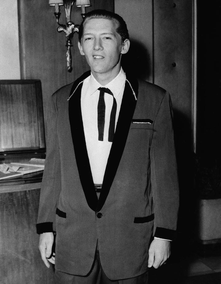 Singer Jerry Lee Lewis leaves the Westbury Hotel in London for rehearsals for his first appearance at the Regal, May 24, 1958. Spokesperson Zach Furman said Lewis died Friday morning, Oct. 28, 2022, at his home in Memphis, Tenn. He was 87.