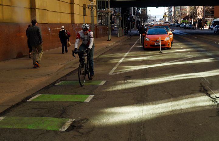 A cyclist rides down a parking-protected bike lane in Denver on Dec. 3, 2015. Because of Republican state lawmakers, Pennsylvania cyclists most likely will not get their parking-protected bike lanes, a common-sense measure that could potentially save lives. 