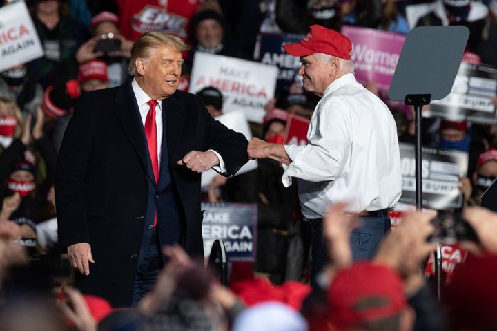 Rep. Mike Kelly (R-Pa.) greets then-President Donald Trump during a campaign in Erie, Pennsylvania, in October 2020.