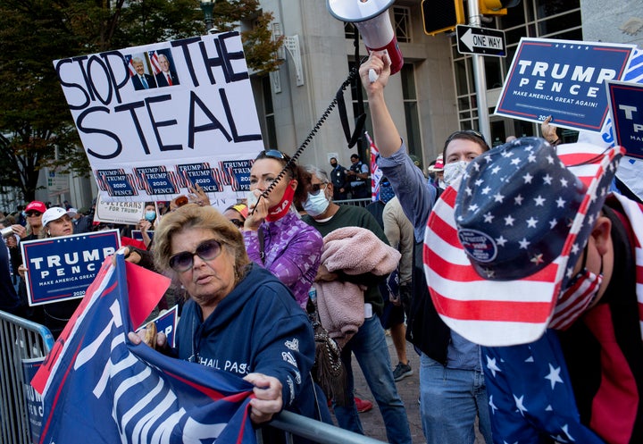 Donald Trump supporters gather outside the Pennsylvania Convention Center to protest mail-in ballots being counted on Nov. 6, 2020, in Philadelphia.