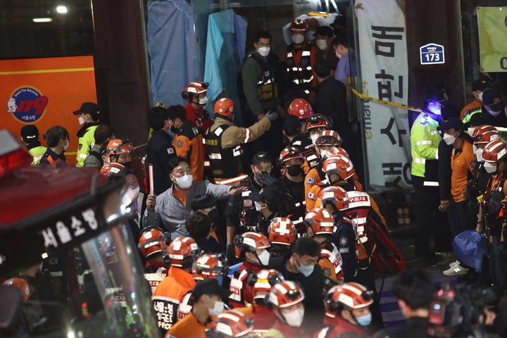 Emergency services treat injured people after a stampede on Oct. 30 in Seoul.