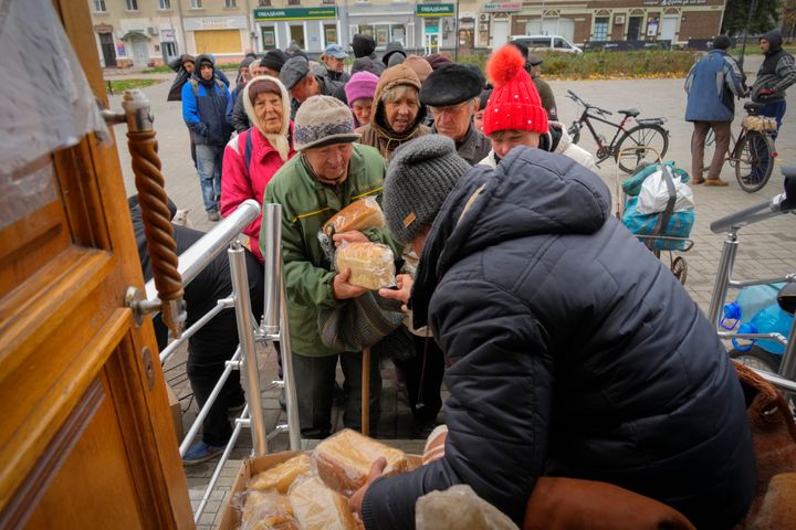 Local residents stand in line waiting for free bread from volunteers Oct. 28 in Bakhmut, the site of the heaviest battle against the Russian troops in the Donetsk region, Ukraine.