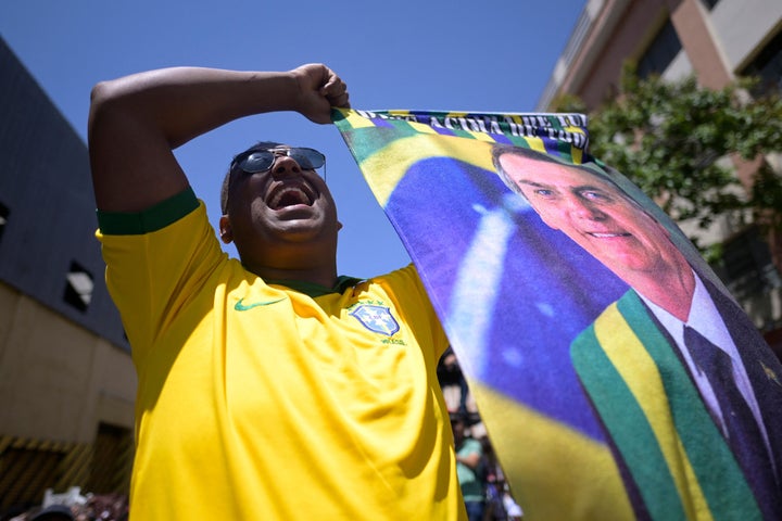 A supporter of Brazilian President Jair Bolsonaro attends the inauguration of a temple of the Igreja Mundial do Poder de Deus, in Belo Horizonte, Brazil, on Oct. 12.