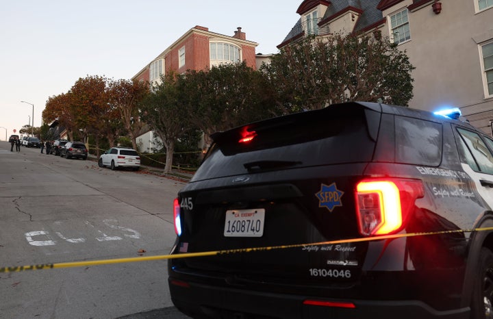 A San Francisco police officer stands guard in front of the home of House Speaker Nancy Pelosi (D-CA) on Friday.