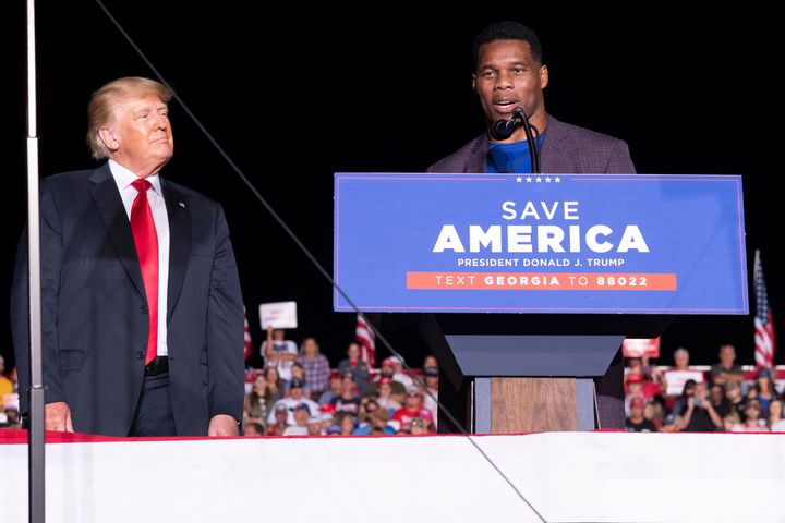 Former President Donald Trump, left, rallies with Georgia Senate candidate Herschel Walker on Sept. 25, 2021. Like Trump, Walker refuses to acknowledge the validity of the 2020 presidential election results.