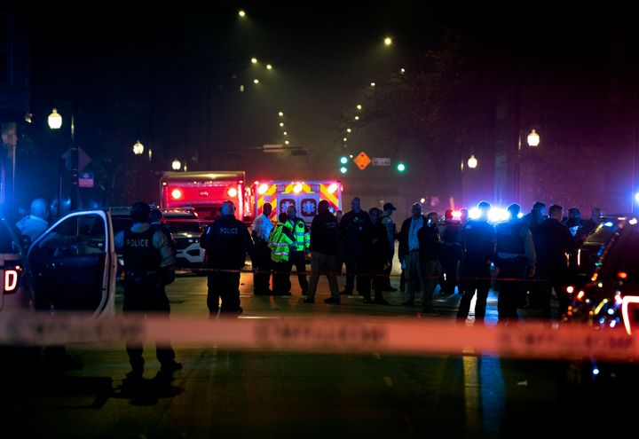 Chicago police and emergency medical responders work at the scene of a mass shooting on the city's West Side on Monday.