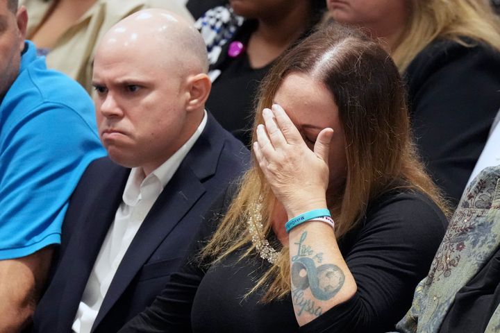 Ilan and Lori Alhadeff, center, react as they hear that their daughter's murderer will not receive the death penalty.