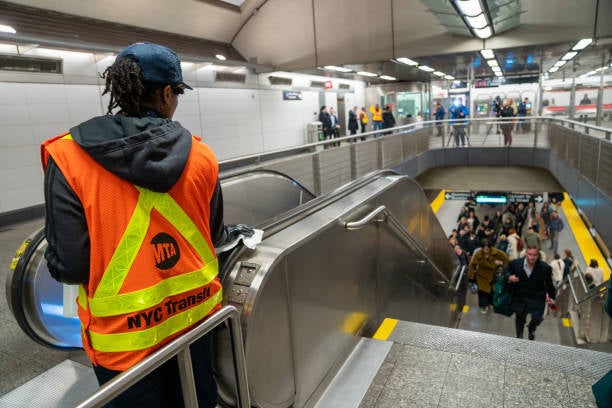 A Metropolitan Transportation Authority worker at the 86th subway station in New York City on March 4, 2020.