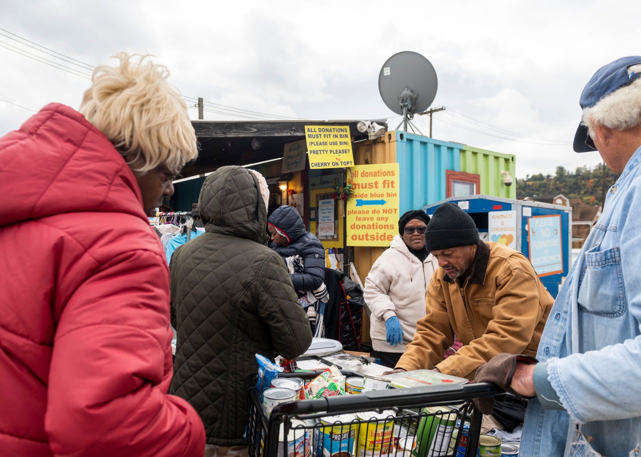 Volunteers sort donated goods outside the Free Store.