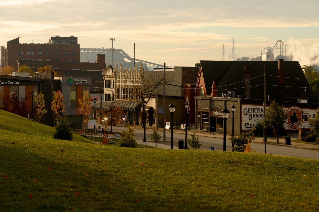The sun rises above businesses along the main street in Braddock, Pa., on Oct. 16. Senate candidate John Fetterman was the town's mayor for 13 years.